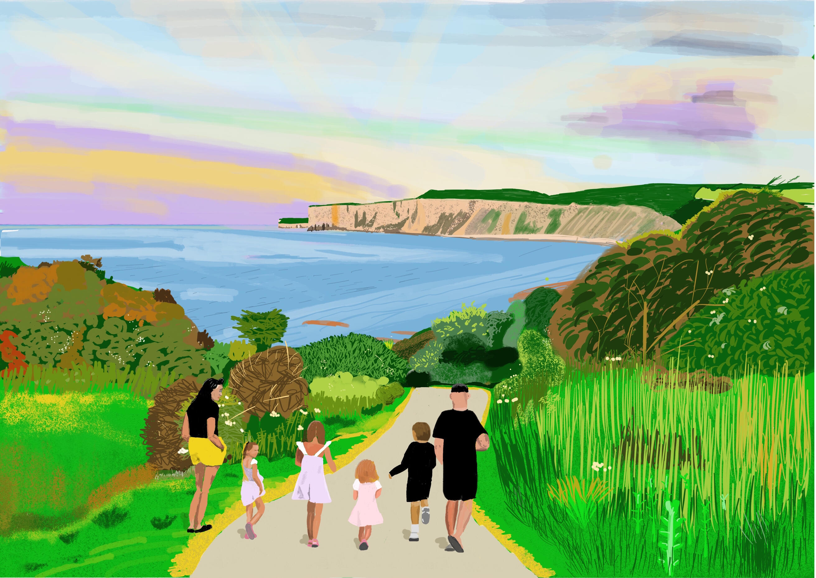 Family group head down to the sea at Filey Bay Yorkshire